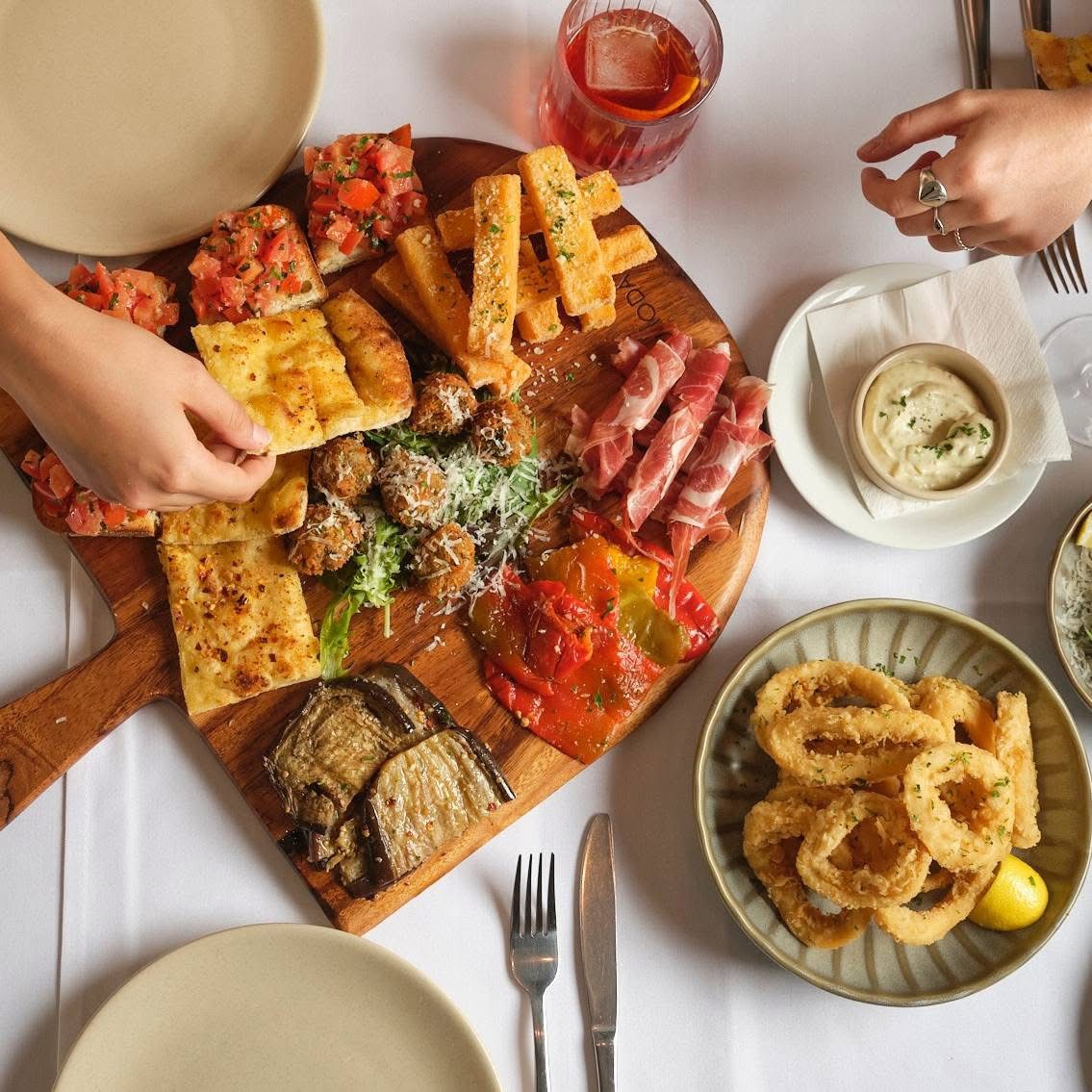 shared platter - bruschetta, proscuitto, eggplant, calamari, polenta chips at Andiamo Trattoria