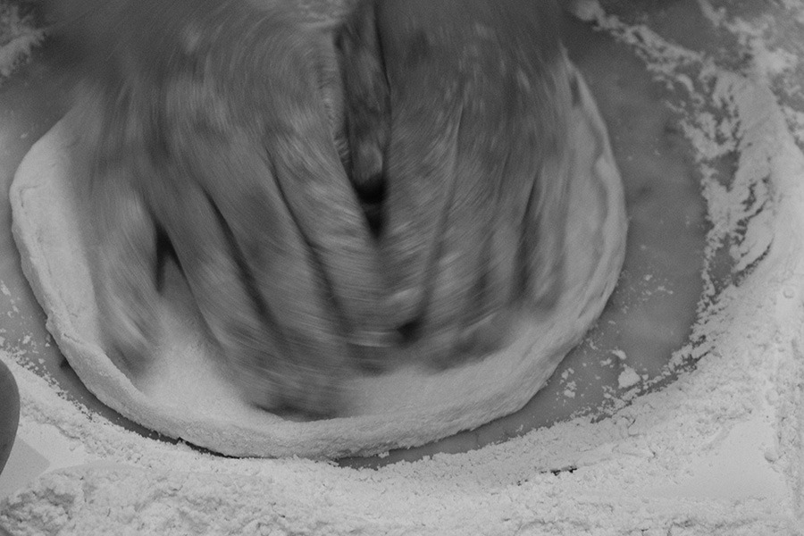Hand-stretching pizza dough at Andiamo Trattoria - stonebaked pizza Sydney