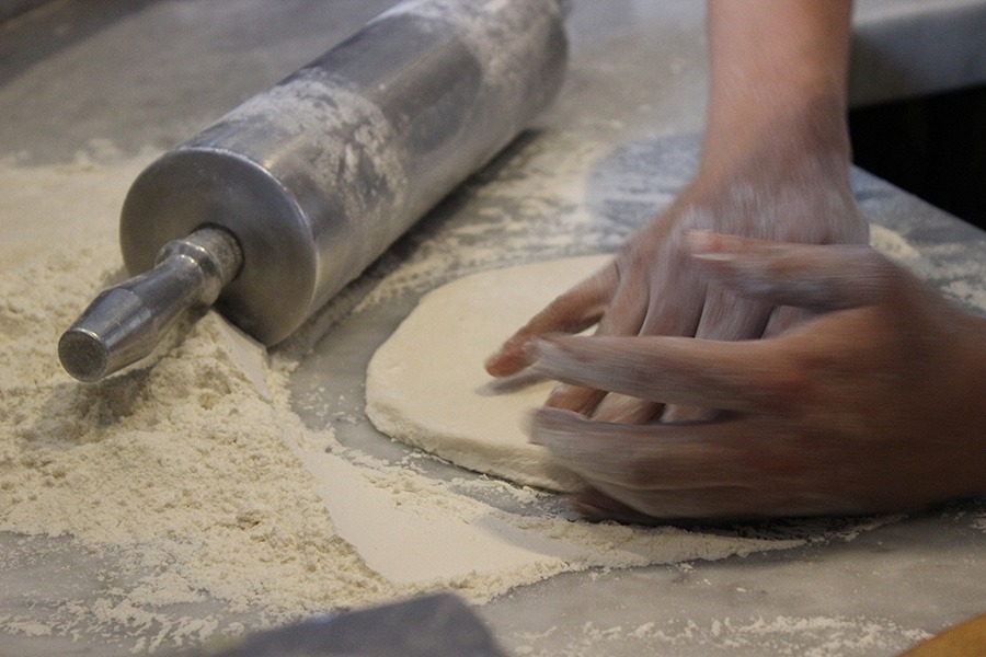 Andiamo pizzaiolo preparing authentic Italian pizza dough