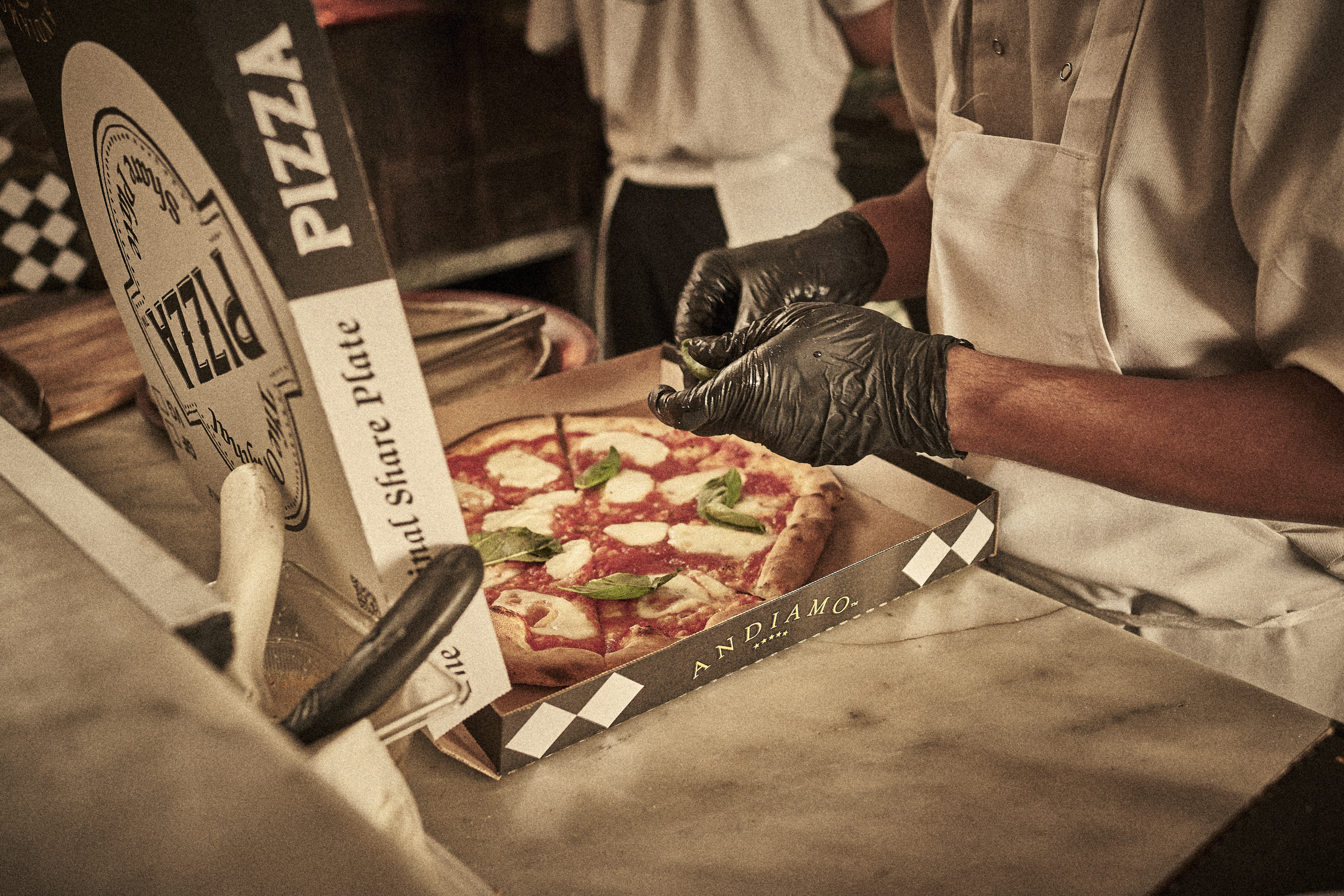 Pizza preparation at Andiamo Trattoria Summer Hill - Inner West Italian restaurant